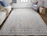 7' X 10' Silver Taupe and Blue Oriental Power Loom Worn Faded Area Rug With Fringe